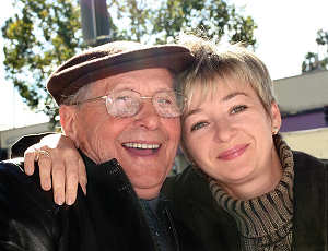 Adult father and daughter, smiling
